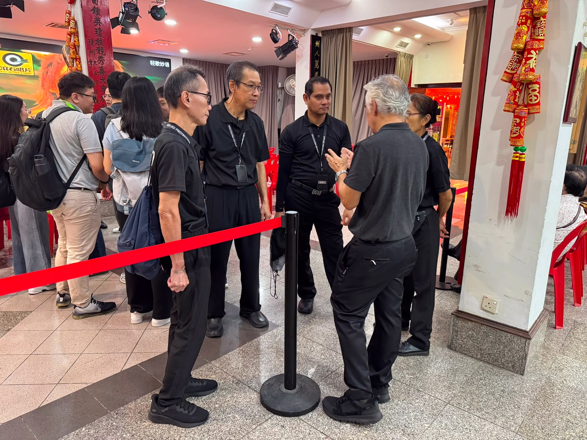 AP's event security team debriefing after the Hainan Hwee Kuan Election 2026 event.